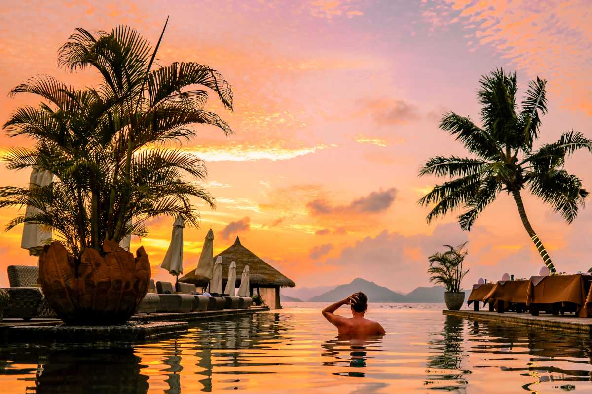 young-men-in-swimming-pool-during-sunset-luxury-s-MHFQVSL_11zon.jpg